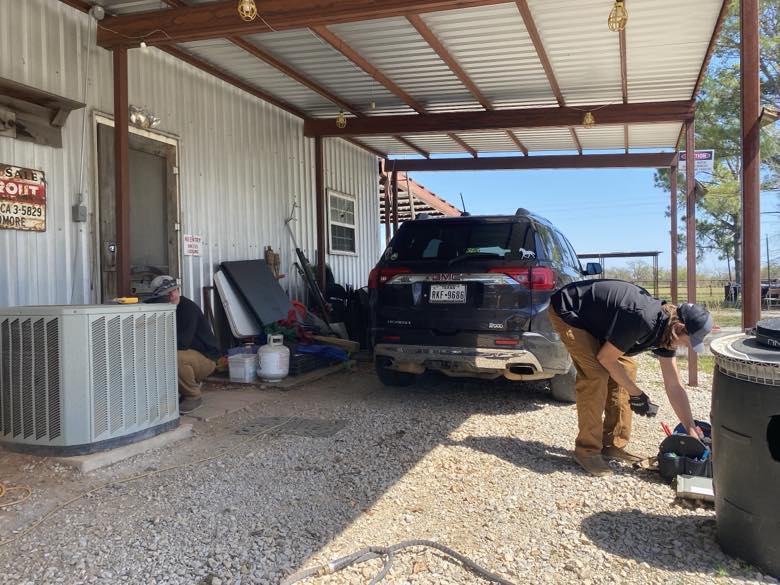 Eagle technicians doing HVAC work at a customer home